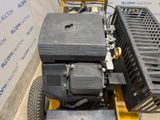 an image of a lawn mower with a box attached to it