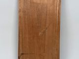 an image of a wooden cutting board with a label on it