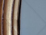 a picture of a close up of a mirror on a wall