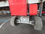 a large red truck that is parked in a parking lot