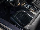 a picture of the interior of a car with black leather seats