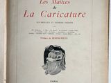 an old book with a picture of a woman holding a baby