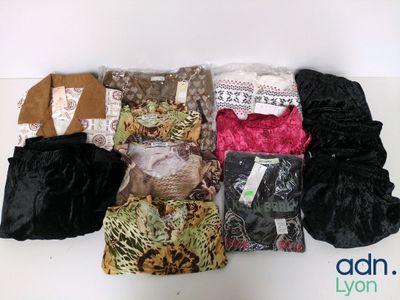 a lot of clothes that are sitting on a table