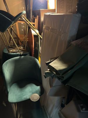 an image of a cluttered room with a chair and other items