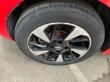 a close up of a tire on a red car
