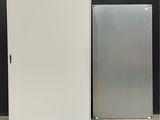 two refrigerators sitting next to each other on a pallet