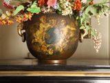 a vase with flowers in it sitting on a table