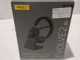a box with a pair of headphones sitting on top of it