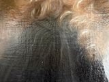 portrait of a man with long curly hair and a beard