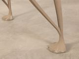 two legs that are bent over on a table