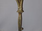 an antique brass table lamp with two birds on a branch