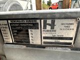 a label on the back of a machine that is sitting on the ground