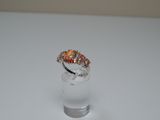 an image of a ring with a fire opal in it on a white surface