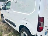 a white van that is parked in the grass