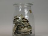 a glass jar filled with a pile of rocks