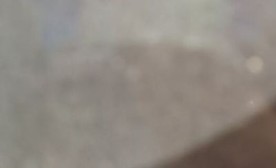 a blurry photo of a person holding a cell phone
