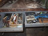 many tools in the drawer of a workbench