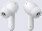 an image of two white earphones on a gray background