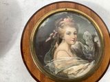 a picture of a woman with a bird in her hand