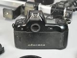 a camera that is sitting on a table next to other electronics