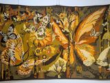 a picture of a tapestry hanging on a wall