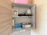 a cabinet with a lot of items on top of it