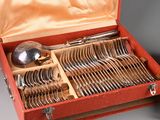 a red case with silverware in it on a table