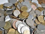 a pile of coins sitting on top of a table