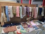 a table with many different types of clothing on it