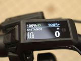 a close up of a bike with a gps device on it ' s handlebar