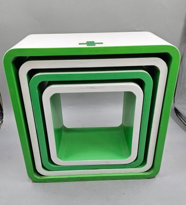 three green and white nesting boxes stacked on top of each other
