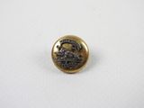 a close up of a button with a horse on it