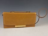 tan leather clutch bag with gold metal clasp