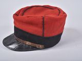 hat is red and black with a leather band around the brim