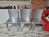 three chairs that are next to each other in a room