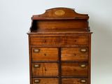 an old wooden dresser with a mirror on top of it