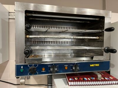 an image of a toaster oven that is open and ready to be cooked