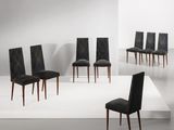 six chaises de salle à manger en cuir noir dans une pièce blanche au sol blanc