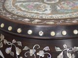 a wooden table with a floral design on it