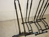 a rack that has a bunch of golf clubs on it