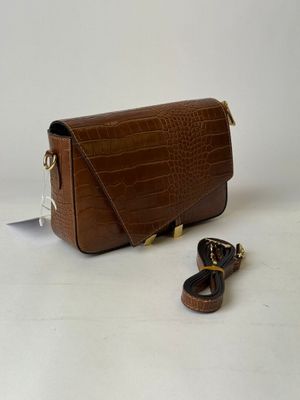 brown leather cross body bag with gold hardware and strap