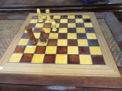 a chess board with a chess piece on it on a table