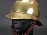 a gold helmet on a mannequin head