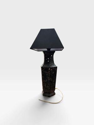 an image of a black lamp with a black shade on it