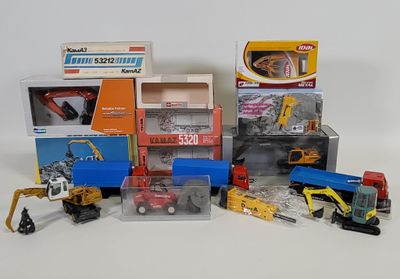 many different types of toy trucks and construction equipment