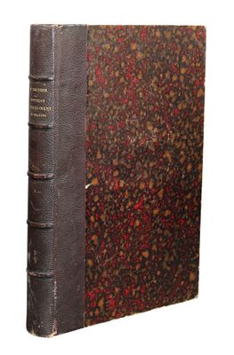 an old book sitting on top of a table covered in red and brown flowers