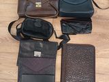 many different types of purses and wallets laid out on the floor