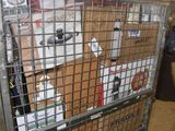 a large metal cage filled with boxes in a warehouse