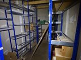 a room with shelves and boxes in it