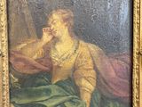un vieux tableau représentant une femme en robe verte, assise sur une chaise